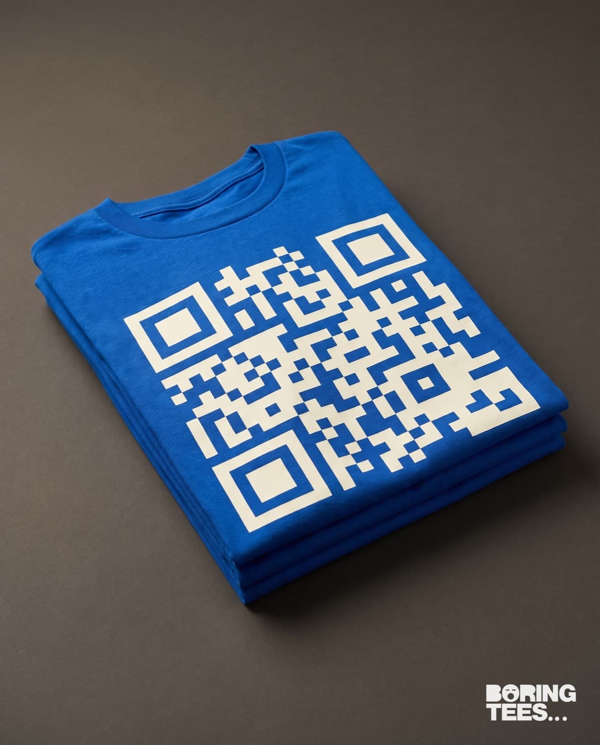 Folded royal blue tees with a large white QR code printed across the back