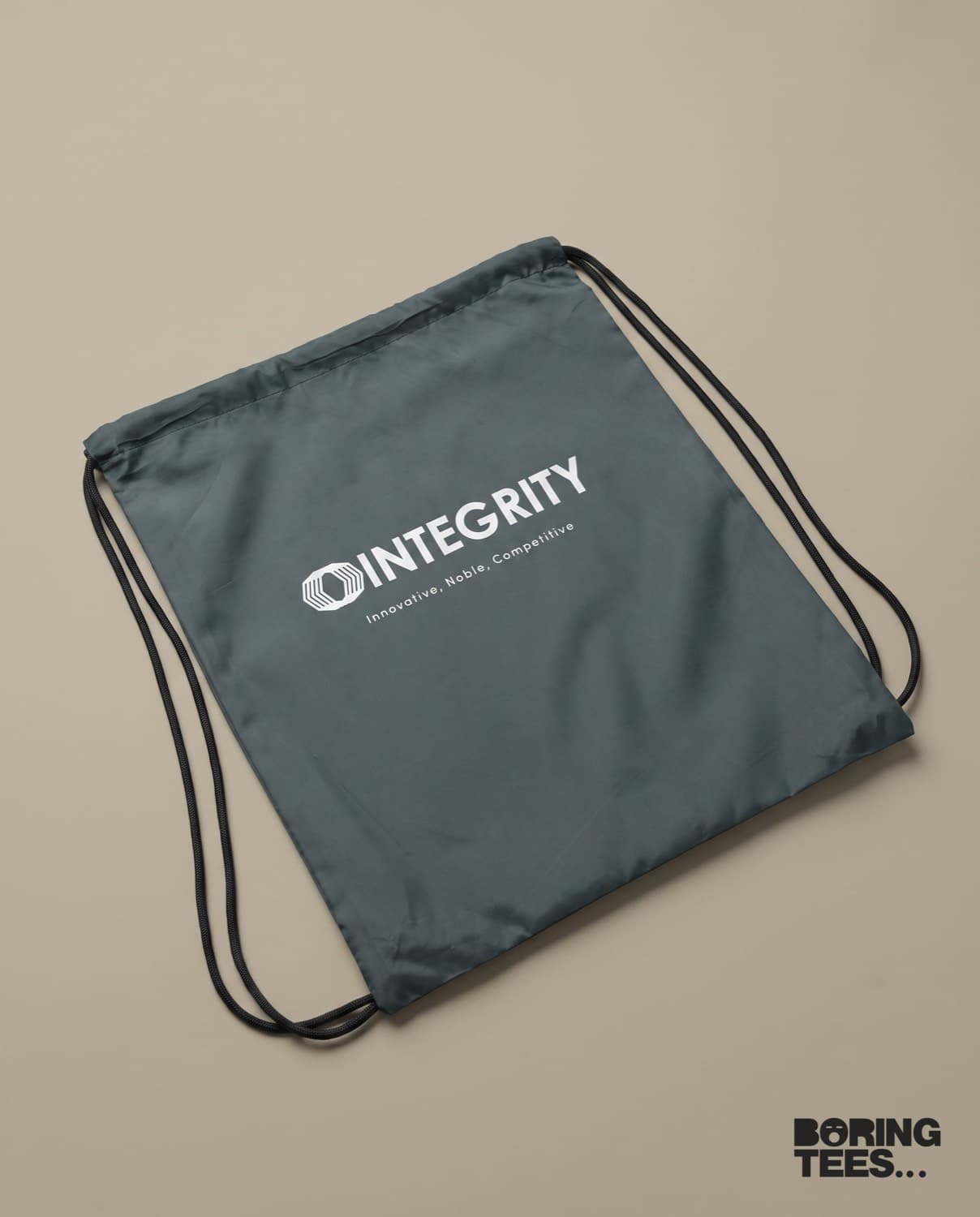 Slate grey drawstring cinch bag with a white Integrity logo and tagline printed on the centre panel