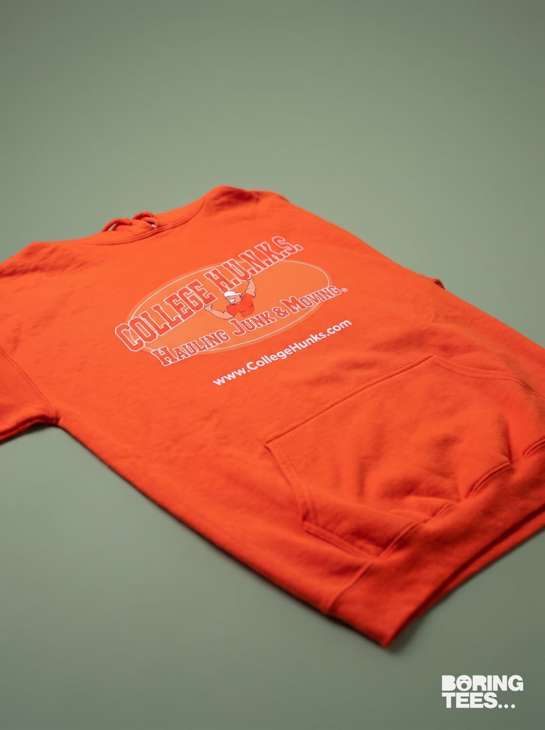 Orange hoodie with the College Hunks logo printed front centre in orange and white