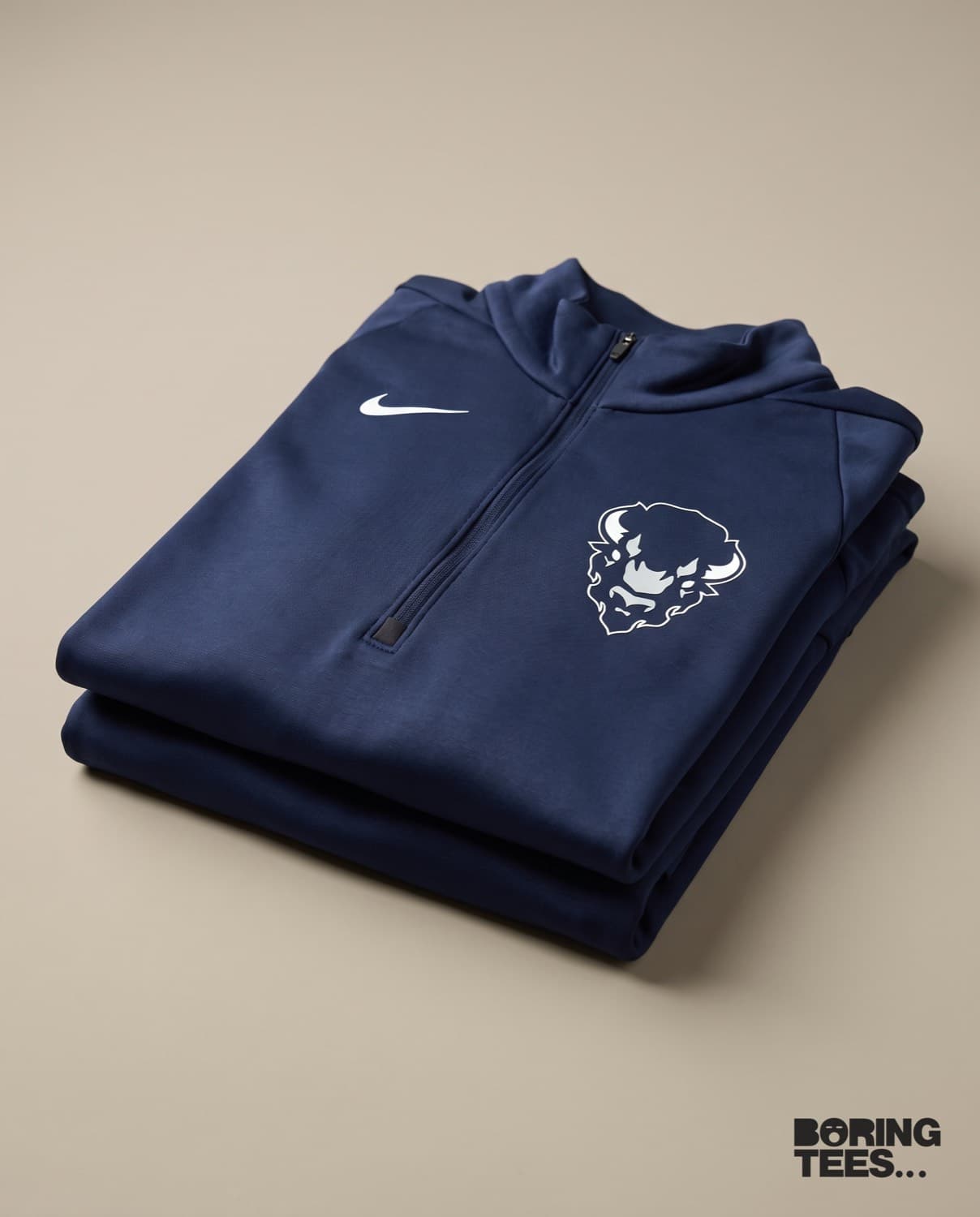 Navy Nike quarter-zip fleece with a white Bison mark on the left chest